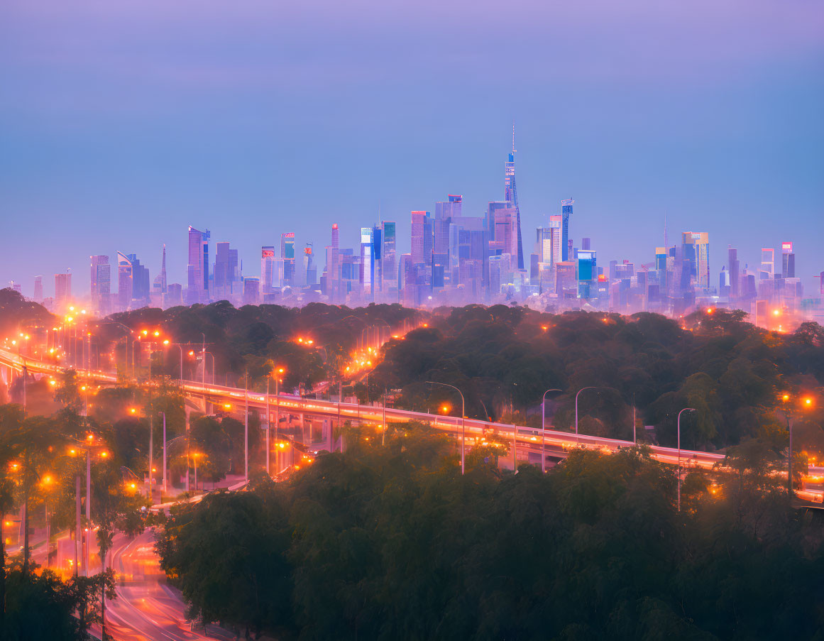 Glowing skyscrapers and busy highway in twilight cityscape