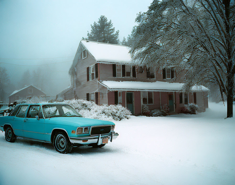 Vintage Turquoise Car Outside Snow-Covered House