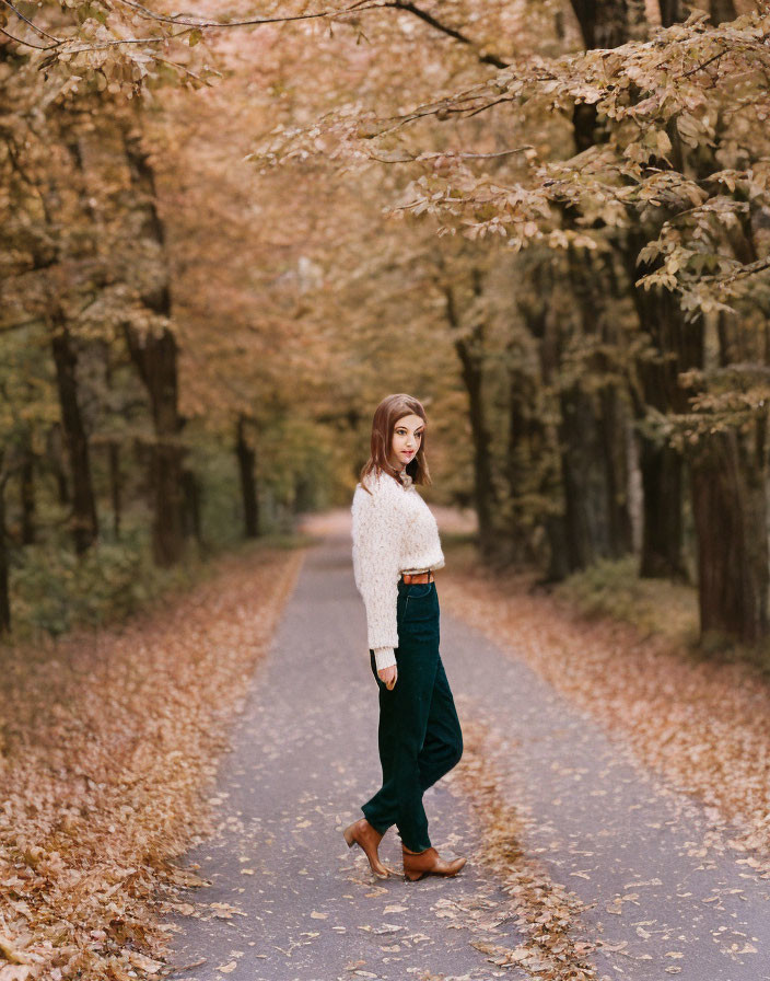 Woman in White Fluffy Sweater Walking Among Fall Foliage