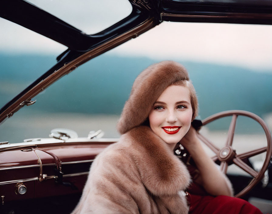 Woman in fur stole and red lipstick in classic convertible car