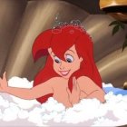 Animated Red-Haired Woman Smiling in Foamy Bathtub