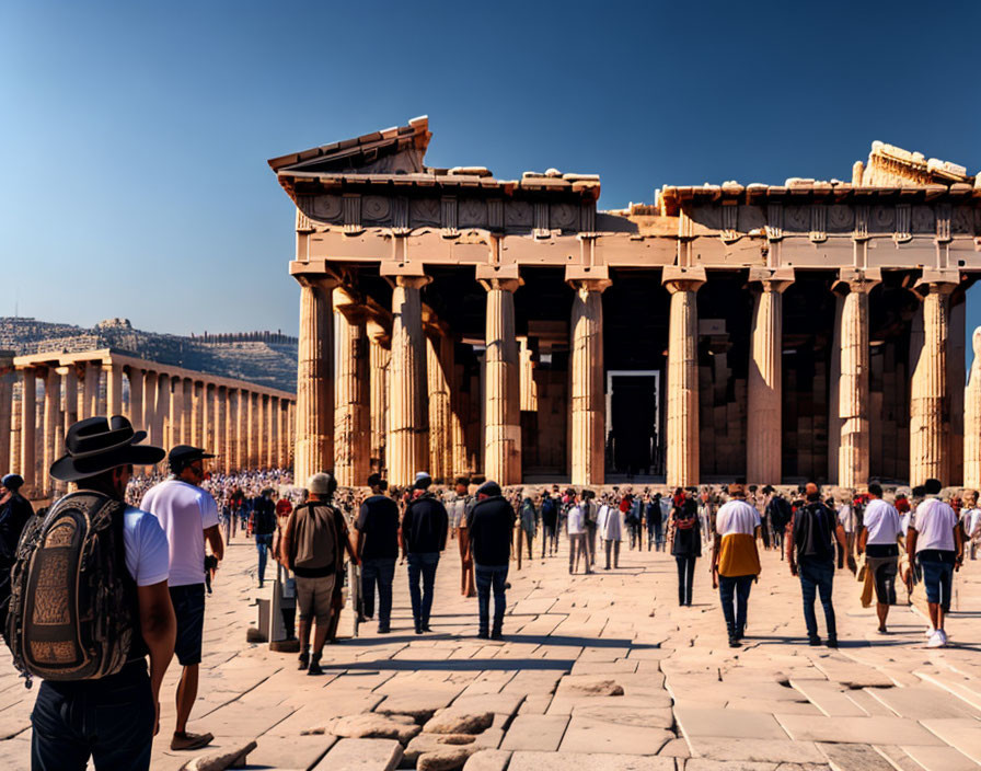 Tourists walking to Parthenon temple, Acropolis of Athens, clear blue sky