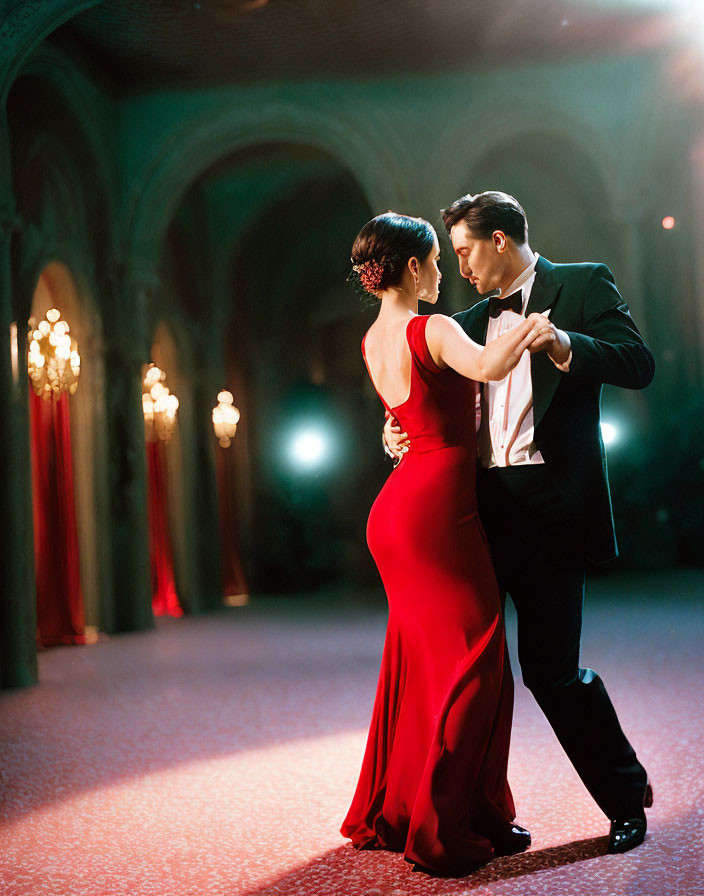 Formal attire couple dancing in elegant ballroom