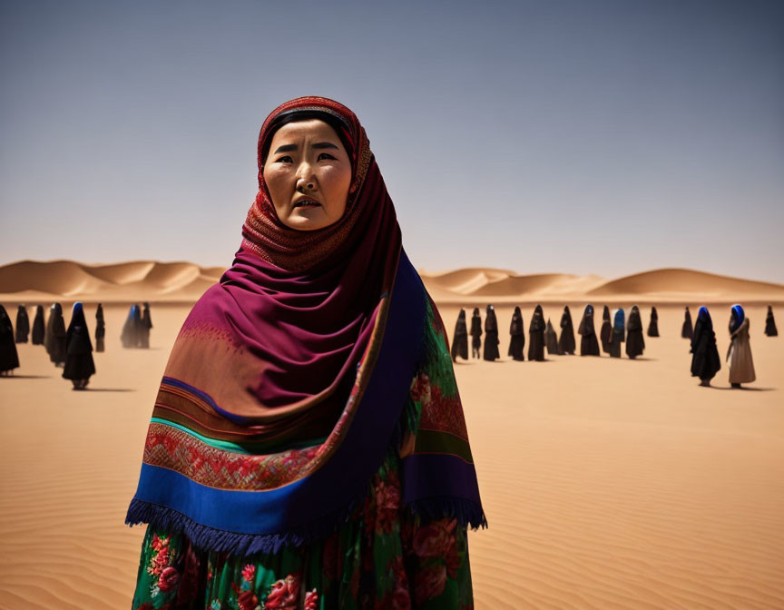 Colorful Shawl-Wearing Woman in Desert with Robed Figures Under Blue Sky