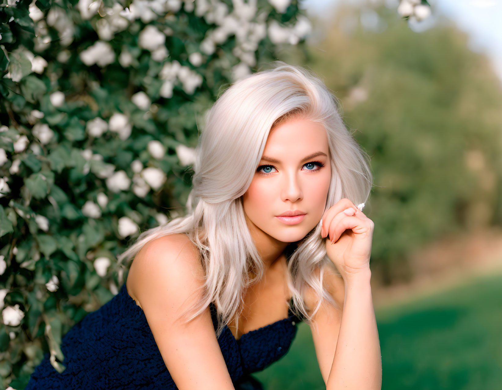 Platinum Blonde Woman in Blue Dress with Blue Eyes