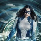 Futuristic digital artwork: Woman in blue armor with flowing brown hair