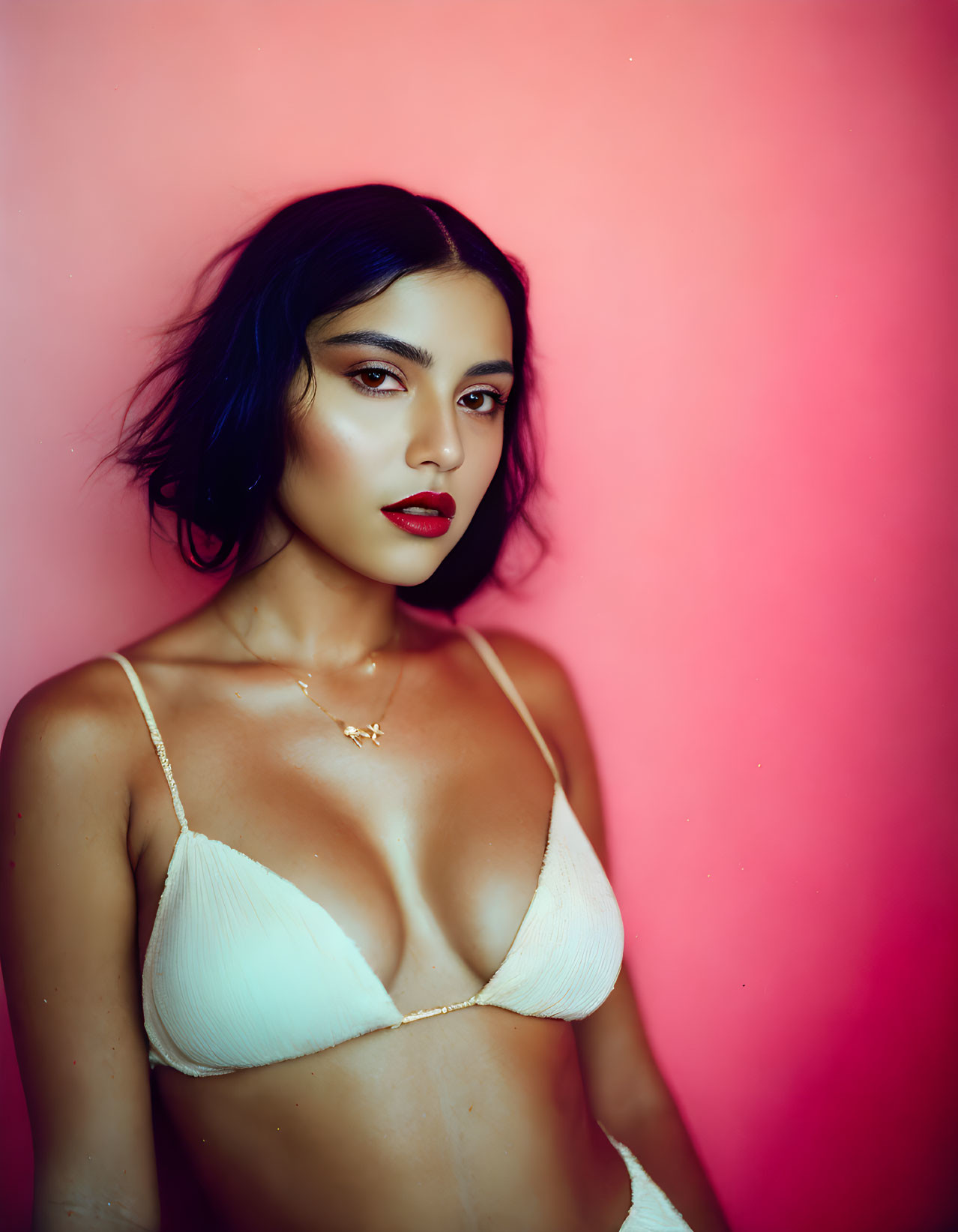 Woman in Red Lipstick and White Top on Pink Background