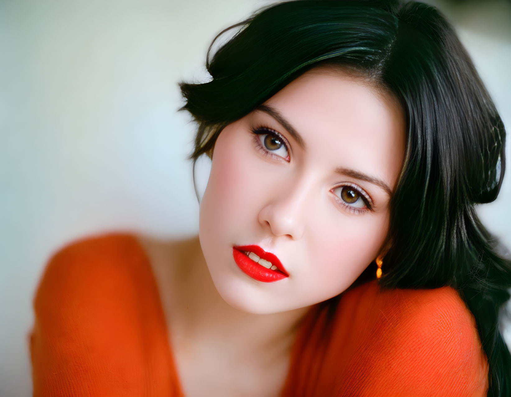 Portrait of woman with dark hair and red lipstick