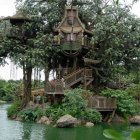 Whimsical treehouse in ancient tree with turquoise foliage