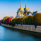 Traditional Asian Palace with Tiered Roofs and Golden Spires by Calm River