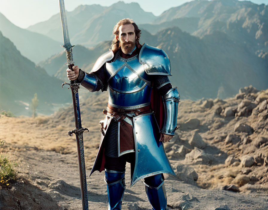 Knight in full armor with sword in rocky terrain and mountains.