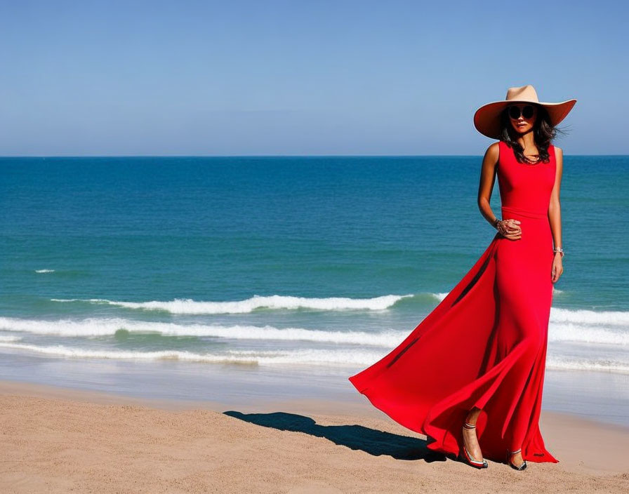 Woman in Red Dress and Wide-Brimmed Hat on Sandy Beach