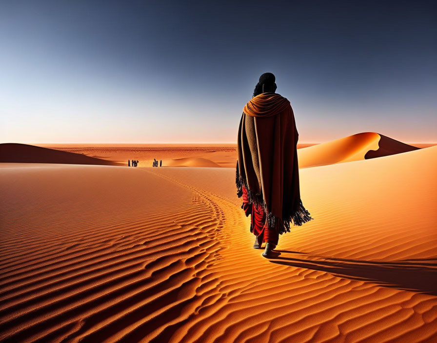 Mysterious figure in cloak on sand dunes under orange sky