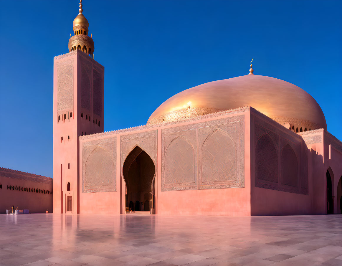 Golden-domed mosque with ornate minaret in twilight setting