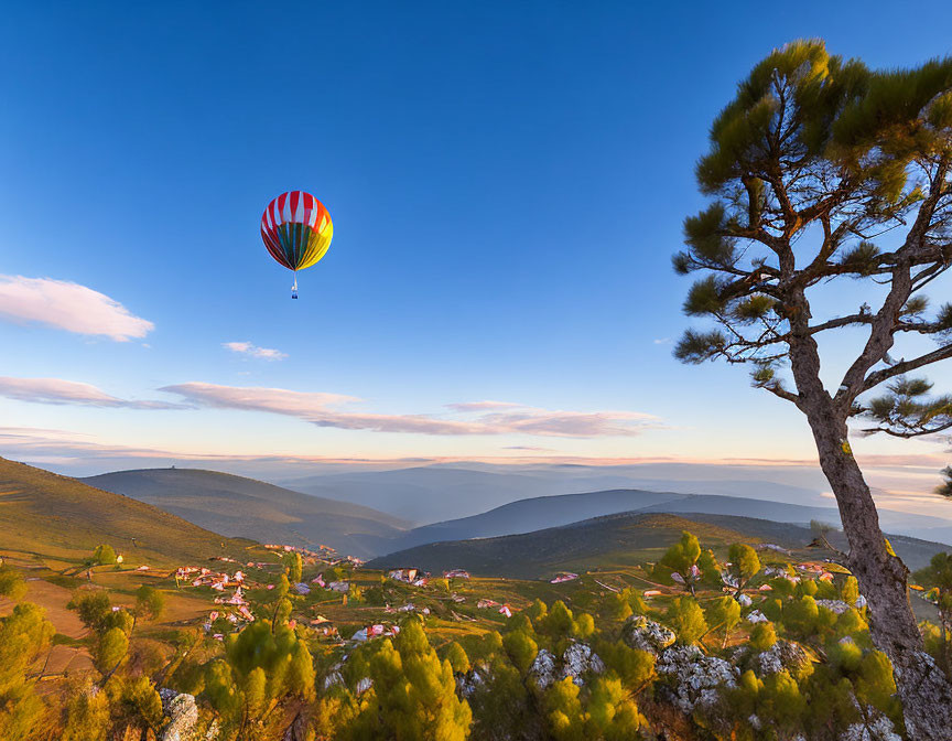 Colorful hot air balloon over scenic landscape at dusk