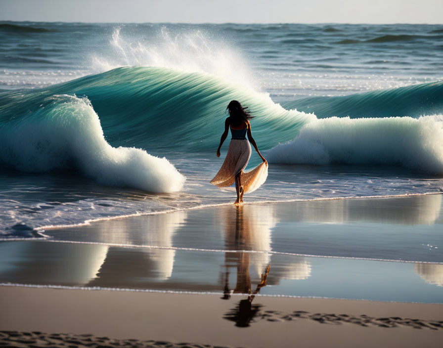 Person walking towards ocean with large cresting wave in background