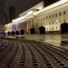 Vintage train travels through misty mountain landscape at dusk