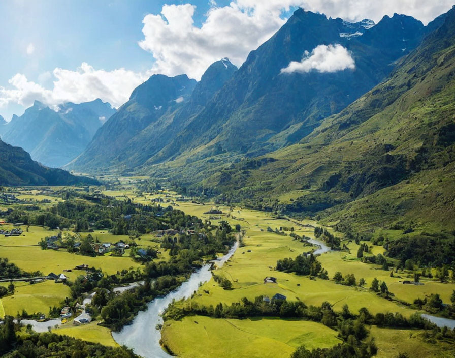 Lush Green Valley with River and Mountains