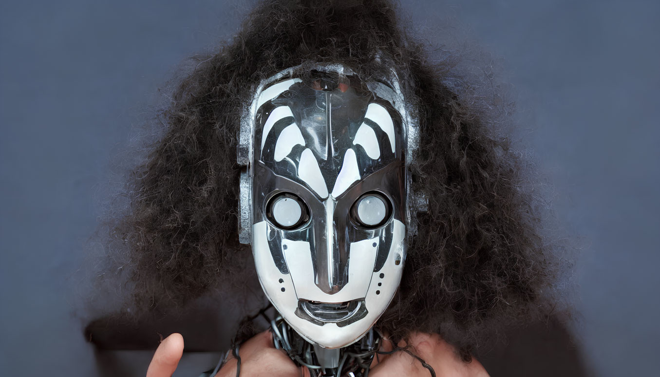 Futuristic silver mask with intricate designs and frizzy dark hairstyle