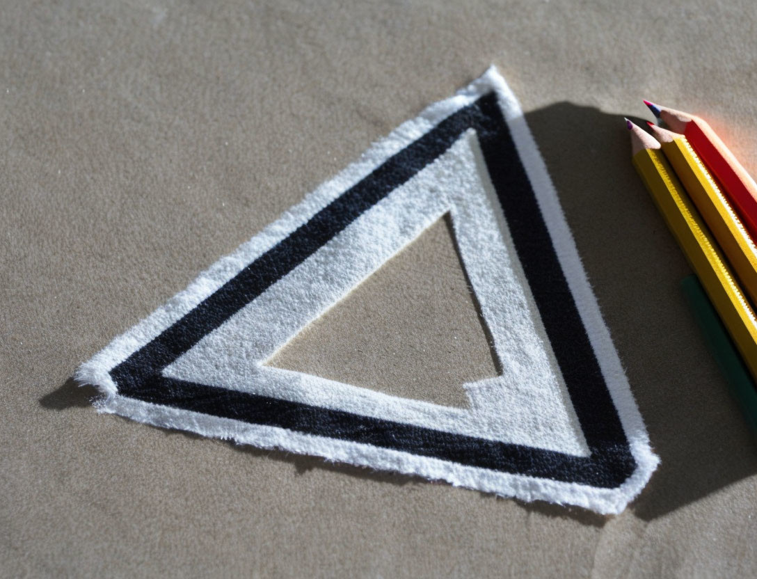 Penrose Triangle Illusion Embroidered on Fabric with Colored Pencils and Shadow