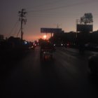 Urban Twilight Scene with Rain and Dim Streetlights