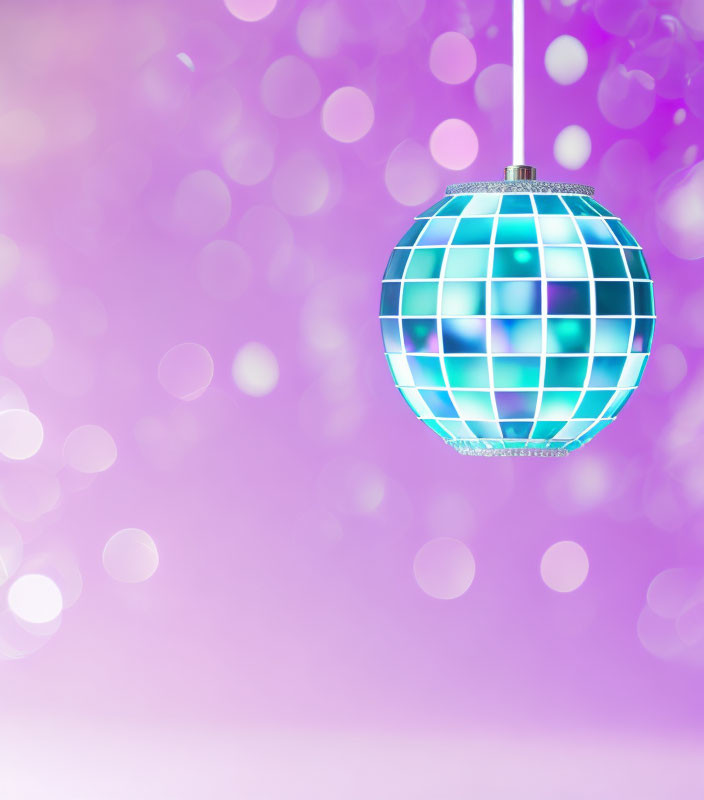 Shiny Blue Disco Ball with Square Mirrors on Blurred Purple Background