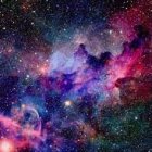 Vibrant blue and pink nebulae in high-speed interstellar scene