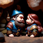 Regal King and Queen Figurines in Cozy Cave Setting