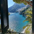 Colorful Landscape Stained Glass Window with Ocean Waves and Cozy House