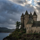 Abandoned church in gothic architecture near lake under dramatic sky