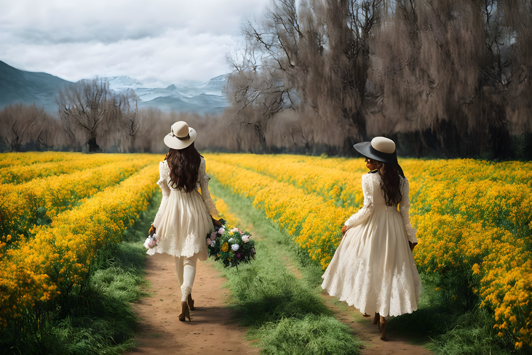 Women in white dresses walking in vibrant flower field with mountains.