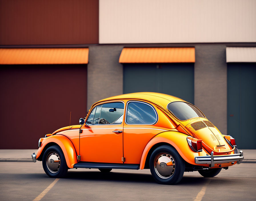 Vintage orange Volkswagen Beetle parked in front of a building under a clear sky