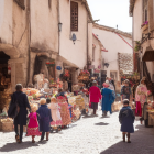 Traditional Marketplace with Vendors and Locals in Cultural Attire