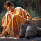 Woman in flowy dress with grains basket and boots against lush greenery