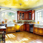 Sunlit kitchen with yellow tones, wooden cabinetry, lantern, and orange flowers