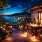 Candlelit terrace overlooking coastal town at night