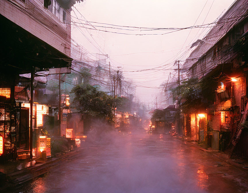 Misty street at twilight with glowing shopfront signs