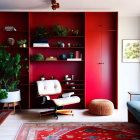 Colorful Room with Red Shelving, White Chair, Turquoise Sofa, and Indoor Plants