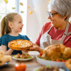 Elderly Women, Child, and Fruit Bowls in Vintage Room