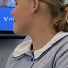 Blonde woman with blue eyes in embroidered jacket and fur collar