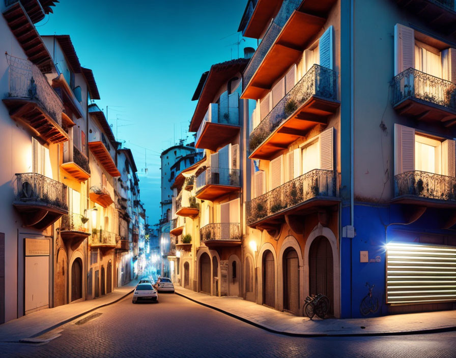 European street at twilight with traditional buildings and car.