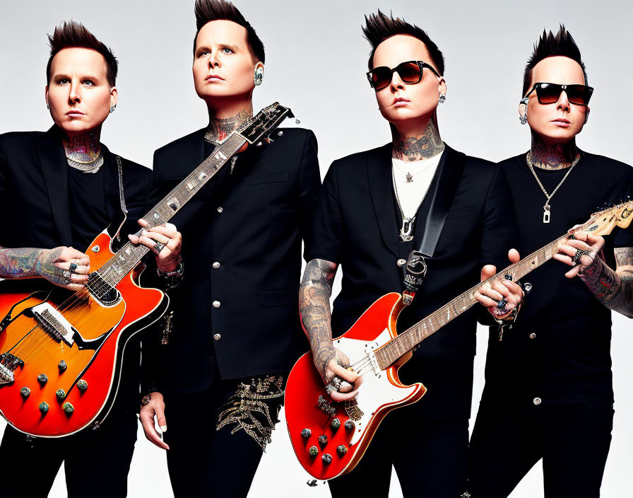 Four tattooed men in black attire holding guitars on red background