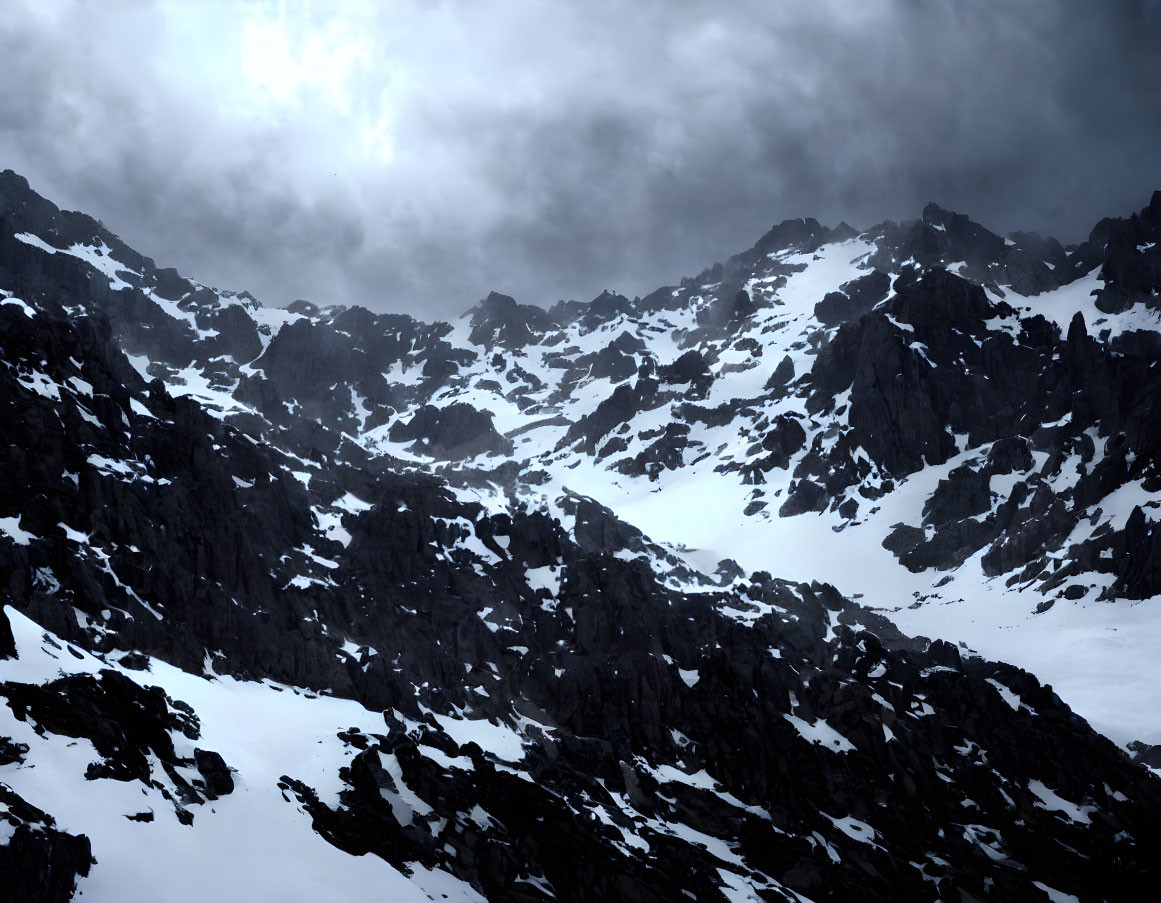 Snow-covered mountain peaks under dramatic cloudy sky with sun peeking through