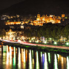 Colorful illustration of castles on hill with river reflections, bridge, and dramatic sky