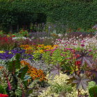 Colorful Garden Path with Flowers and Lampposts in Mystical Dusk Landscape