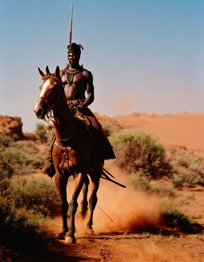 Traditional attire person on horseback with spear in dusty landscape