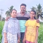 Family of Four Poses in Desert with Sparse Vegetation