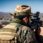 Person in Camouflage Uniform Aiming Rifle in Desert Environment