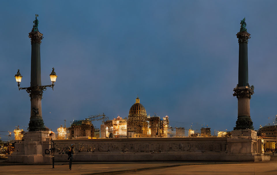 Historic square at twilight with columns, statues, person walking, and lit dome.