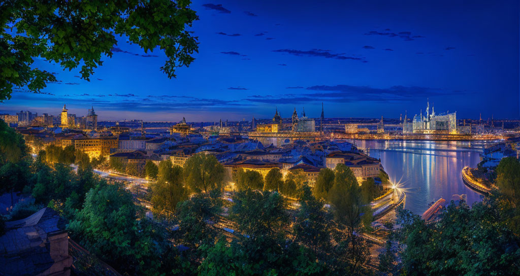 Cityscape at Twilight: River, Illuminated Buildings, Bridges